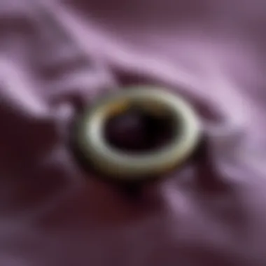 Close-up view of a metal grommet installed in fabric