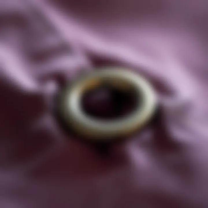 Close-up view of a metal grommet installed in fabric