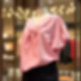 Elegant light pink top draped on a stylish mannequin