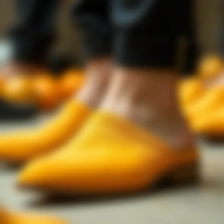 Close-up of the craftsmanship in orange mules showing intricate details