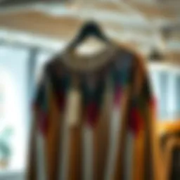 Stylish ripped knitted sweater draped elegantly on a hanger