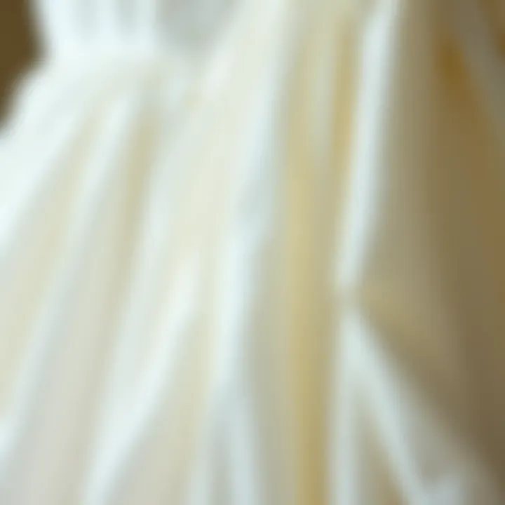 Close-up of fabric choices for a white dress