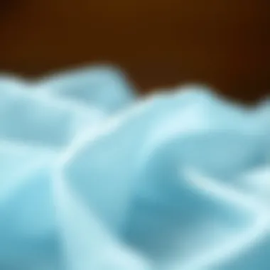 Delicate Texture of Light Blue Cheesecloth A close-up view of light blue cheesecloth showcasing its delicate texture