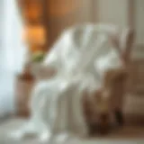 Luxurious White Bathrobe in a Cozy Setting Luxurious white bathrobe draped elegantly on a plush chair