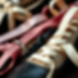 A close-up view of various ribbon shoe strings showcasing different materials and textures.