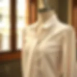 Elegant feminine white blouse draped on a mannequin