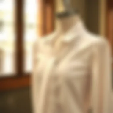 Elegant feminine white blouse draped on a mannequin