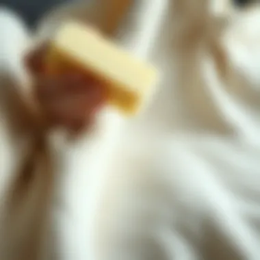 Close-up of emery sponge in action on fabric