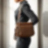 A stylish underarm bag displayed against a minimalist background.